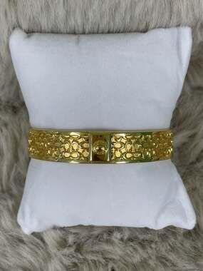 Coach Gold-Tone 1/2 in Signature Embossed C Logo Bangle Bracelet